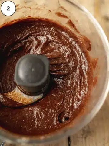 Vegan Nutella spread in the base of a food processor after blending and scraping to creamy perfection.