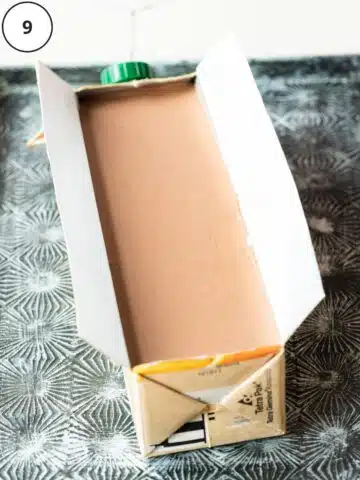 a juice carton filled with homemade no churn chocolate ice cream.