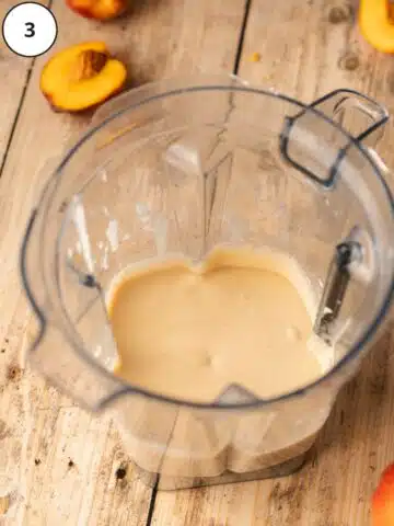 No-bake vegan cheesecake batter in the pitcher of a high-speed blender.