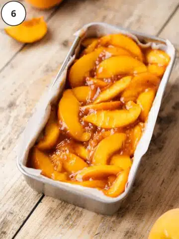 Peach cheesecake topping added as the last layer of the small-batch no-bake cheesecake in a loaf tin before freezing.