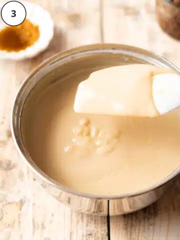 Custard after cooking — it’s creamy and thick enough to coat the spatula.