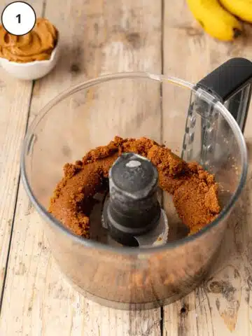No-bake biscoff cookie press-in crust ingredients after blitzing in a food processor.