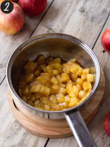 apple cubes, lemon juice, and brown sugar cooked in a saucepan for apple curd.