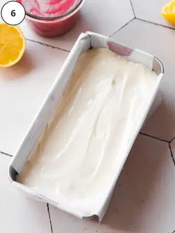 creamy cheesecake filling in a lined loaf pan.
