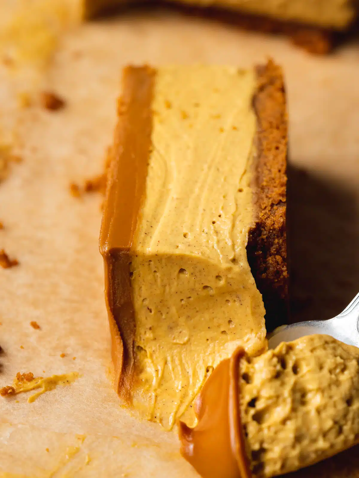 Featuring a velvety, dreamy cheesecake that melts in your mouth, infused with the warm embrace of pumpkin spice, all cradled within an irresistible Biscoff cookie crust, these Vegan Pumpkin Cheesecake Bars are the easy, no-bake, nut-free treat you’ve been waiting for. Made with just 10 simple ingredients in only a few simple steps, these make-ahead biscoff crust cheesecake bars are about to become your favorite new way to celebrate the season.