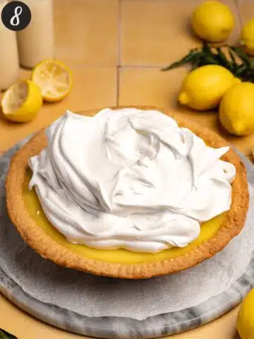 a freshly baked lemon curd pie with aquafaba meringue slathered on top.