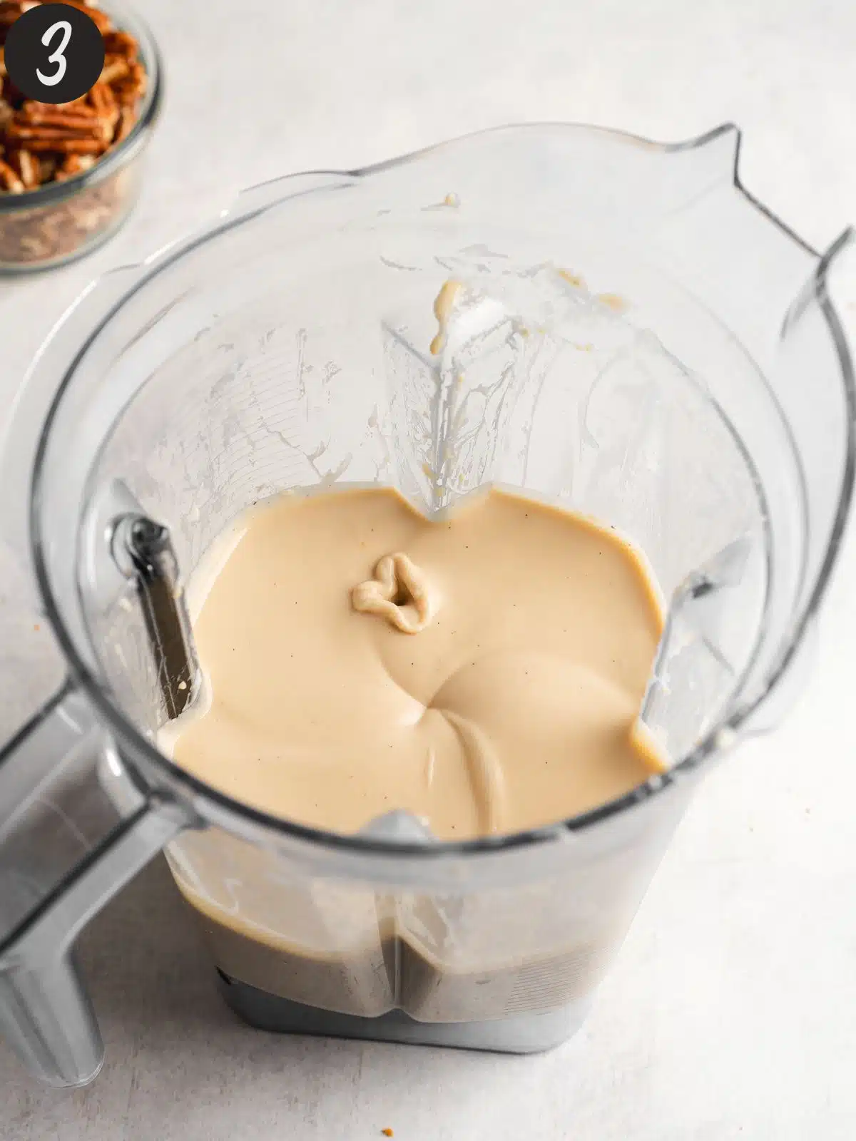 pecan cheesecake filling blended in a blender jug.