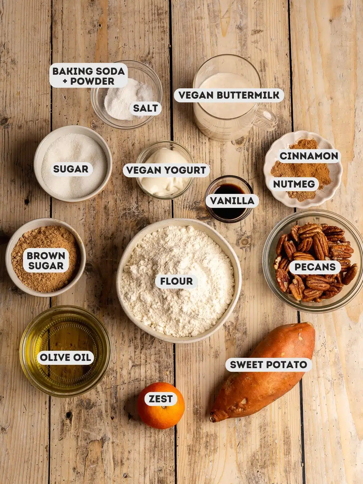 ingredients to make sweet potato loaf cake measured out in bowls on a wooden table with a text overlay.