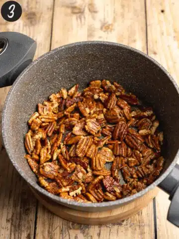 Pecans toasting in the saucepan with an extra tab of butter.