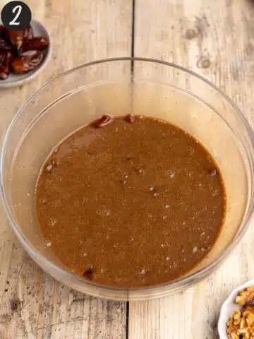 dates, coffee, olive oil, brown sugar, and vegan yogurt mixed together in a large mixing bowl.