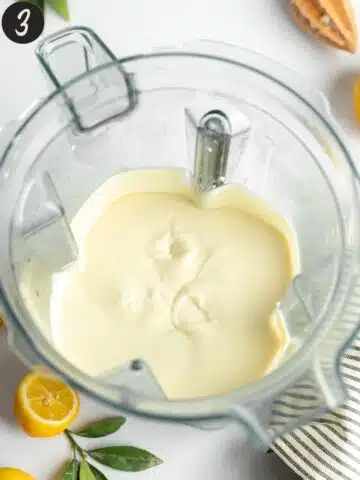 creamy lemon cheesecake filling in the jug of a high-speed blender.