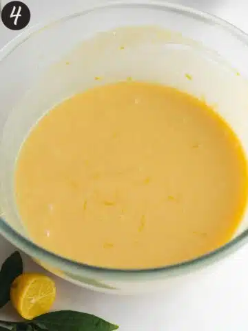 sugar whisked together with oil, vanilla, and vegan butter in a clear bowl.