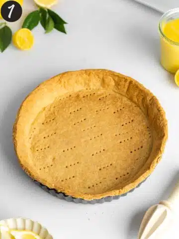 a freshly baked shortcrust pastry tart shell before the lemon filling is added.