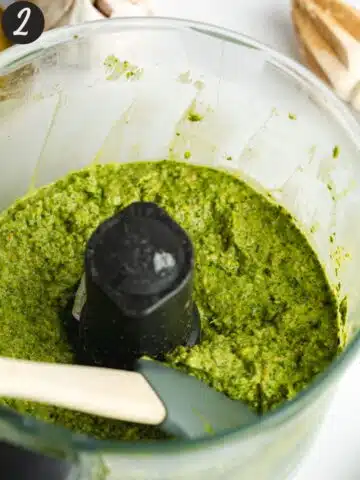pistachio pesto in a food processor after blending.