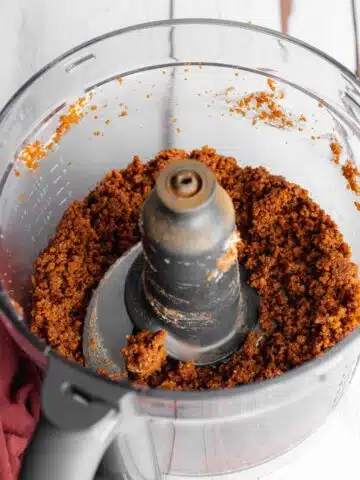 biscoff cookie crust in a food processor jug.